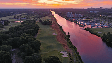 Grande Dunes Red Sky Over 9 green and fairway and Waterway